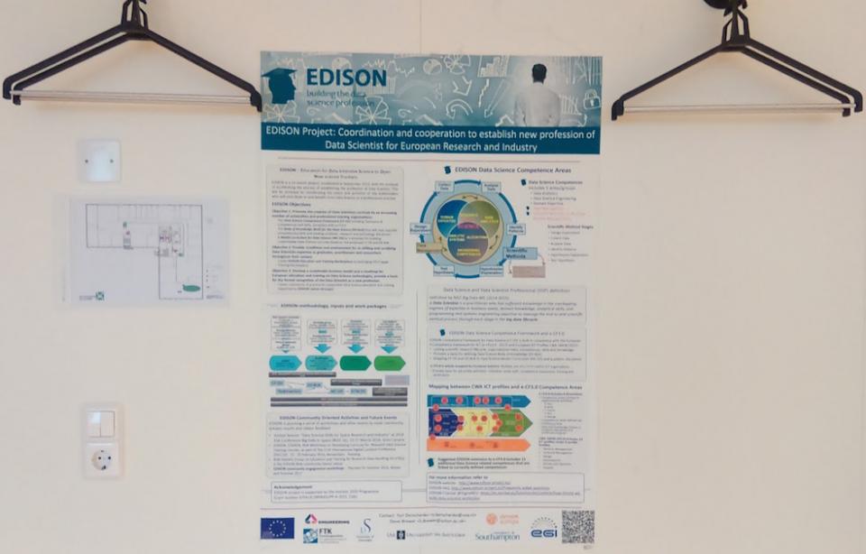 EDISON poster on the wall at an event
